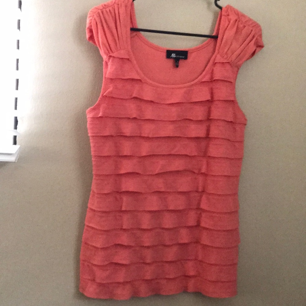 Ruffled coral T-shirt.